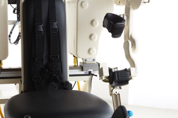 Using seat belts to secure patients during treatment.